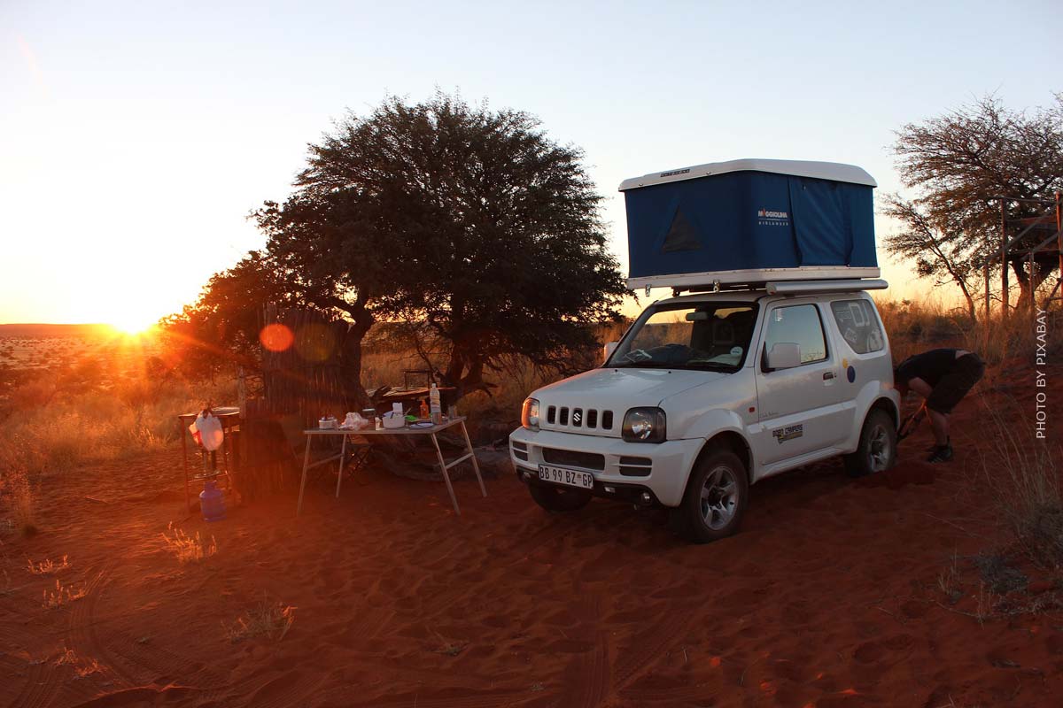 dachzelt-urlaub-auto-zelt-camping-platz-natur-sonne-baum-sunset-himmel